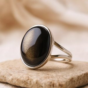 Justerbar ring i gyllene obsidian